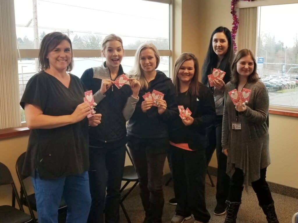 Signature Healthcare at Home team at Valentine's Day exchange at Avamere Court at Keizer in Keizer, Oregon